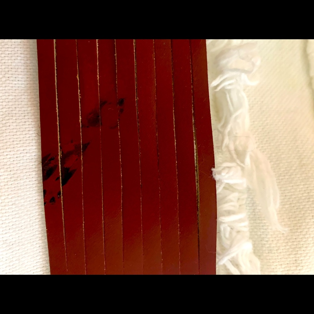 Leather band with snap enclosure. Medium to large size.